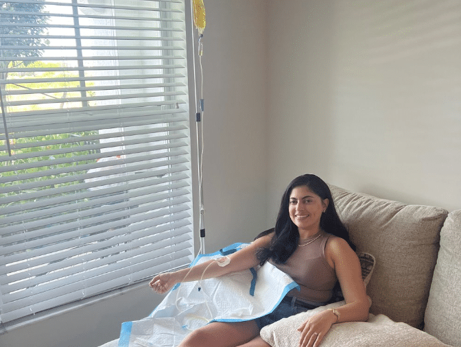 A woman getting Flow IV treatment at home