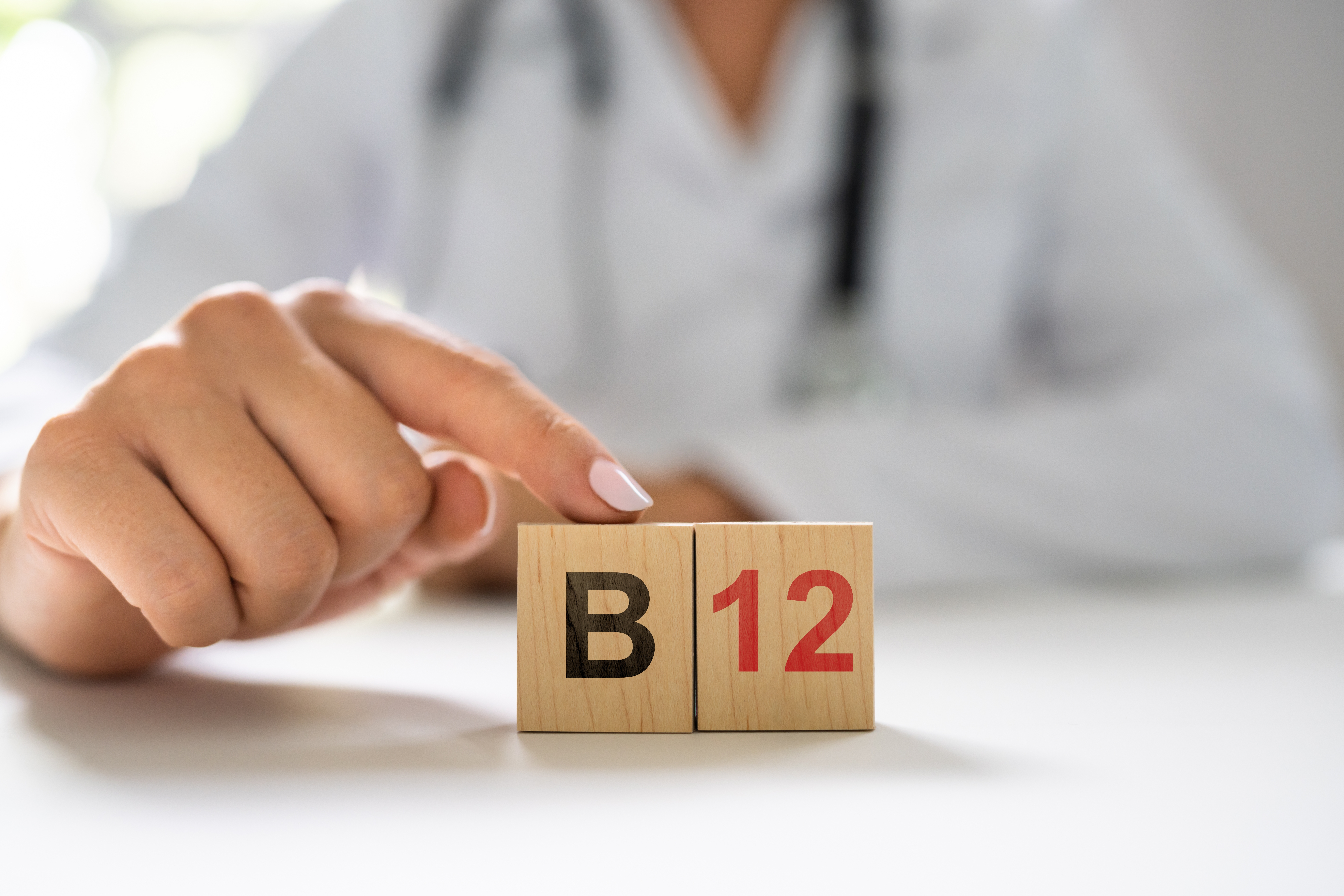 An image of a doctor touching b12 building blocks